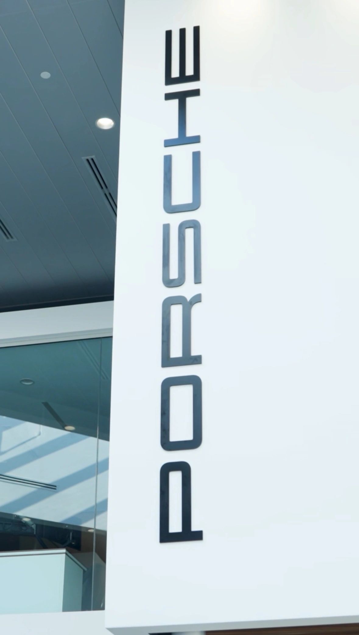 Aerial view of Porsche Nashua Gen 5 Center with rooftop solar array
